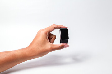 Male hand holding smart watch on isolated background