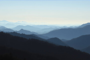 Fototapeta premium Serene mountain range layers at dawn in soft blue hues with misty valleys creating a tranquil atmosphere