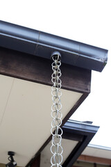 Japanese house rain gutter. Rain chains