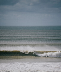 Sea waves near the beach in the sea dark weather