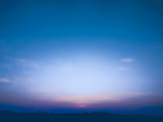 The quiet sunset and the sky slowly faded. Faded colors gradually blend together. This creates a calm, pastel-like gradient. The atmosphere is quiet as day turns to night.