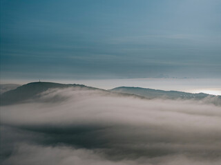 Fog and clouds over the mountains of the island in the sea