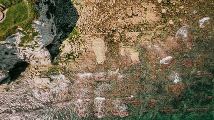 Top view of coastal rocks near the beach 