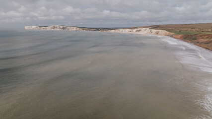 Aerial shot of the sea and its increased level of water near the coastal island