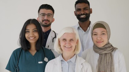 Diversity, doctors and student portrait in hospital with happy face working together as a team. Young, senior and expert medical workers satisfied with teamwork at healthcare facility.