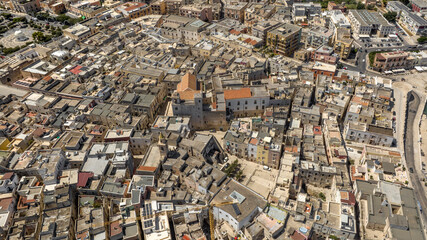 Fototapeta premium Aerial view of the Cathedral of Bisceglie, in Puglia, Italy. The Romanesque church of Saint Peter Apostle is located in the historic center of the town.