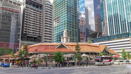 Naklejka premium Telok ayer market with tall skyscrapers on a background timelapse hyperlapse.
