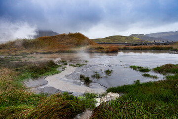Geothermal Hot Spring in Iceland with Stream Rising off the Water