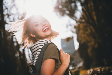 Photo of pretty young blonde woman fluttering hair toothy smile wear khaki clothes tied shoulders...