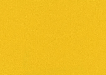 Yellow textured wall background with a smooth and vibrant surface