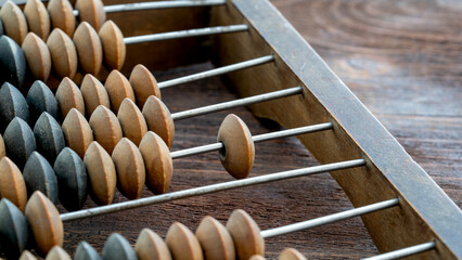 vintage abacus or abacus on wooden background