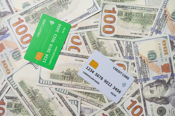 Fototapeta premium credit card and EDC machine on top of a stack of 100 US dollar bills, currency concept.
