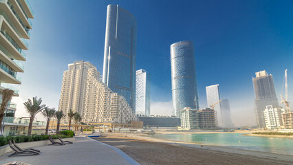 Fototapeta premium Buildings on Al Reem island in Abu Dhabi timelapse hyperlapse