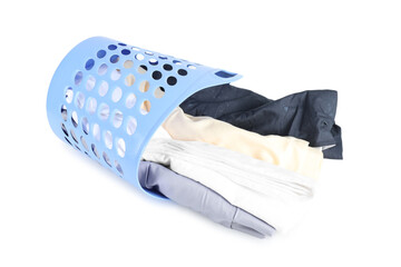 Overturned laundry basket full of clothes isolated on white