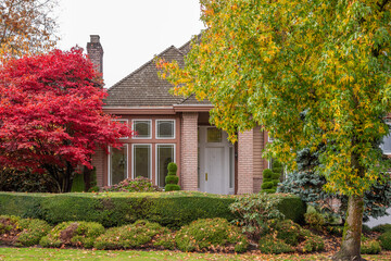 Fragment of  luxury house in fall with green trees and nice landscape in Vancouver, Canada, North America. Day time on November 2024.