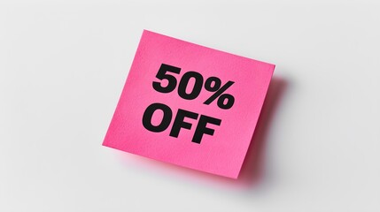 Black '50% OFF' Text on a Magenta Square Paper Note. White Background with Copy Space