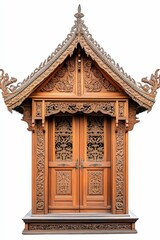 Fototapeta premium Intricately carved wooden temple doorway.