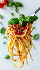 navy pasta with tomato sauce and green basil leaf strung on a fork, on a white background