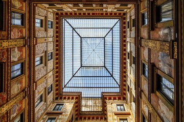 ROME, ITALY February, 15 2023. Passage of Galleria Sciarra with frescoed facades. Oldest shopping center in Rome. Beautiful architecture with allegoric painted walls in Galleries Alberto Sordi.