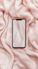 Smartphone on soft pink fabric background