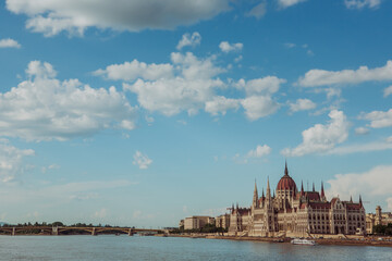 Fototapeta premium Majestic Hungarian Parliament Building with the Danube River in the Foreground: Iconic Views of Budapest's Historic Landmark