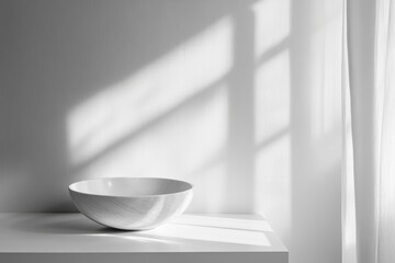 A White Bowl on a Shelf with a Window and Curtain in the Background