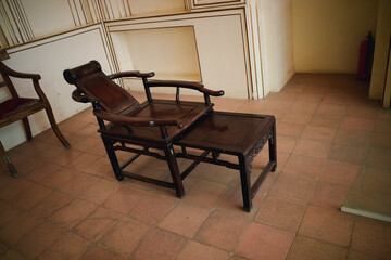 Fototapeta premium Vintage Wooden Reclining Chair with Footrest