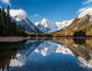 Fototapeta premium serene mountain lake reflecting majestic snow capped peaks