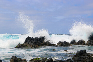 Beautiful water splash after big wave is breaking on costal rocks