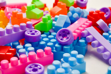 Various colored toy blocks on a white background, educational toys for children