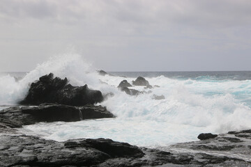wave breaking on the rocks near Mosteiros, Portugal