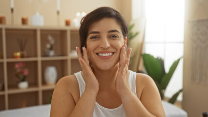 Woman smiling at spa wellness center in beauty room with brunette hair and attractive adult look