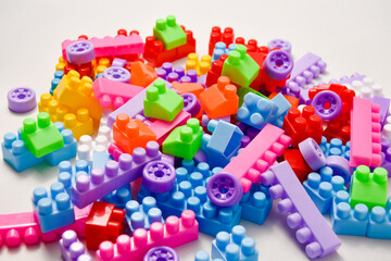 Various colored toy blocks on a white background, educational toys for children