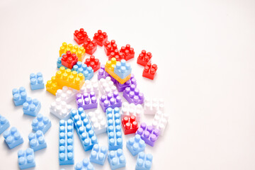 Various colored toy blocks on a white background, educational toys for children