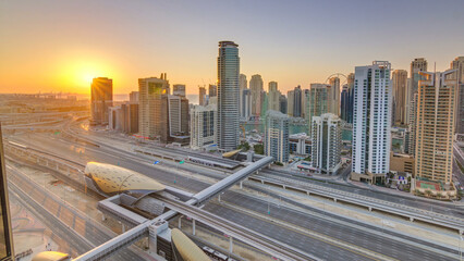 Obraz premium Dubai Marina with colorful sunset in Dubai aerial timelapse, United Arab Emirates