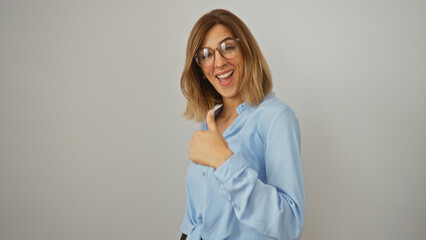 Young attractive caucasian woman in blue shirt smiling with thumbs up over isolated white background