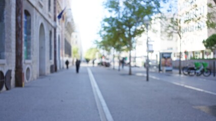 Blurred street view in marseilles with people walking outdoors, showing urban life through a bokeh effect and defocused cityscape in europe, france.
