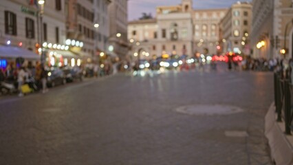 Night scene captures blurred street life in the historic old town of rome, italy, highlighting...