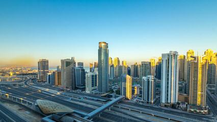 Dubai Marina skyscrapers aerial top view at sunrise from JLT in Dubai timelapse, UAE.
