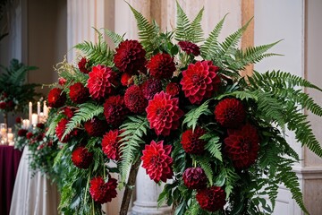 Fototapeta premium Elegant Event Decor with Lush Floral Cascade Featuring Red Dahlias and Ferns for Stunning Invitations