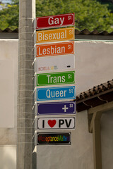 Signs on a street pole gay bisexual lesbian trans queer acceptance matters. Unity, kindness,...