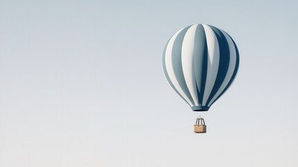 Obraz premium A serene hot air balloon floats gracefully against a clear sky, showcasing its elegant stripes and inviting adventure.