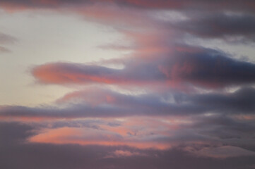 A beautiful sunset featuring a significant amount of clouds in the sky