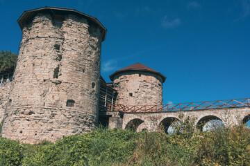 Ancient stone fortress towers with bridge and archways