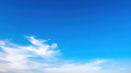Obraz premium Cloudless sky with vibrant blue hues and a few wispy white clouds scattered across the horizon, landscape, nature