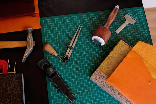 Tools and Materials for Crafting Leather Goods on a Workbench