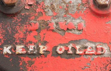 Close-up of Rusty Textured Metal with Keep Oiled Marking