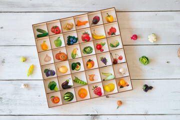 Shopping bag with wooden vegetables. Educational toys. Cute kids toys to play in the kitchen.