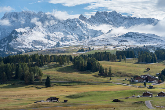 Scenic alpine meadow with snow-capped mountains in the Dolomites