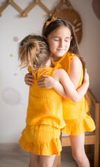 Cheerful little girl hugging in the park.